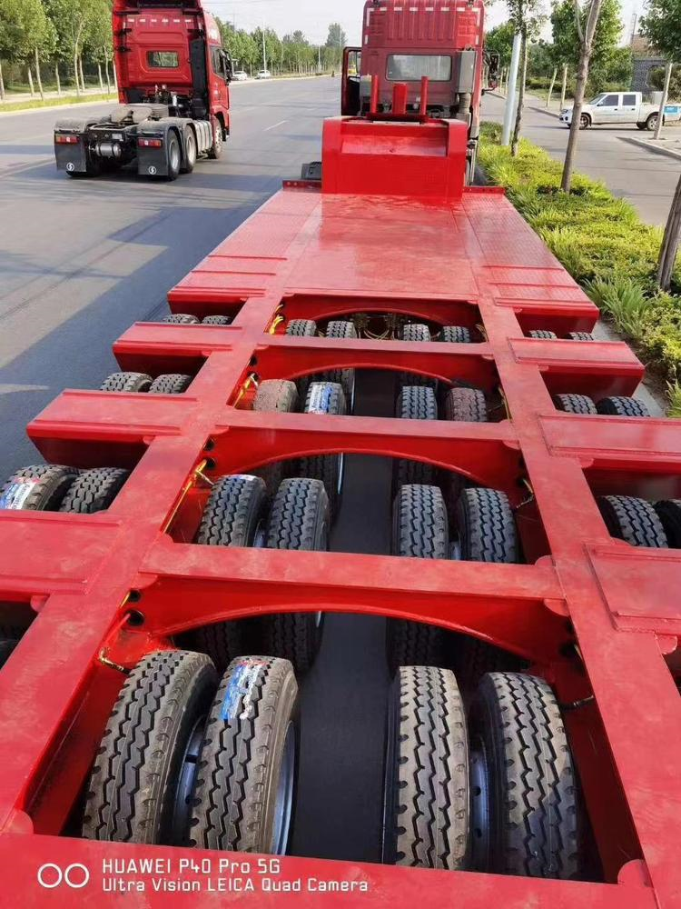 多軸線特種車24個(gè)輪胎半掛車 液壓爬梯低平板車型制造廠家